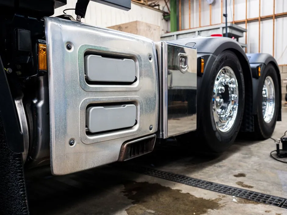 Close-up of truck wheels and brake components in a workshop